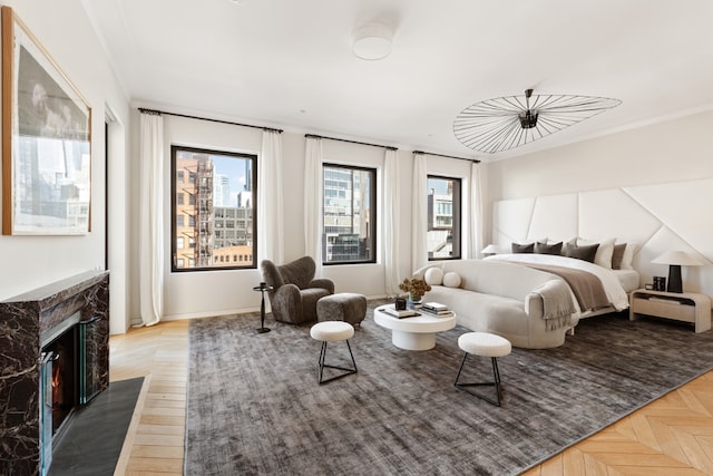 bedroom featuring parquet flooring and a high end fireplace