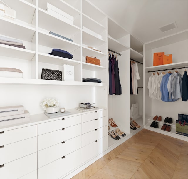 spacious closet with light parquet floors