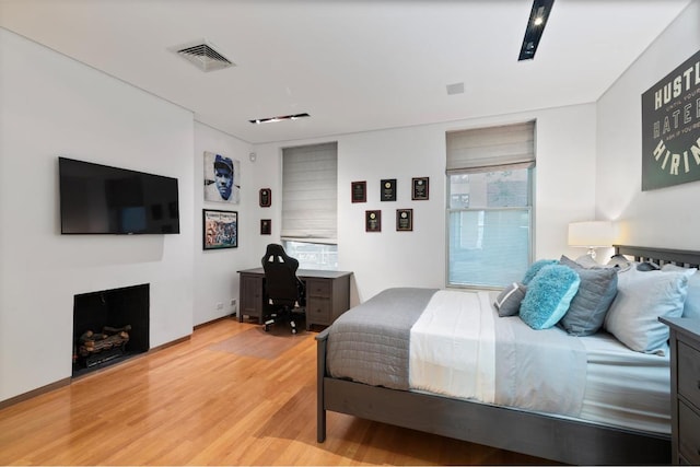 bedroom with light hardwood / wood-style flooring