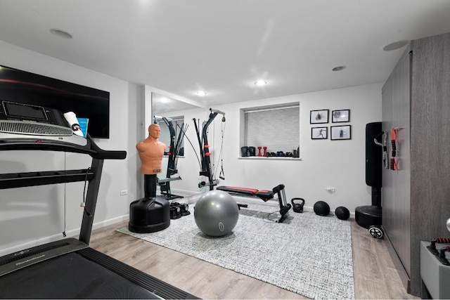 exercise area featuring light hardwood / wood-style floors