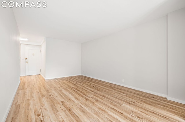 unfurnished room featuring light wood-type flooring