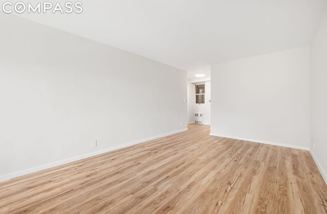 spare room featuring light hardwood / wood-style flooring