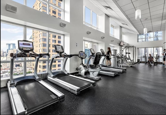 gym featuring a paneled ceiling