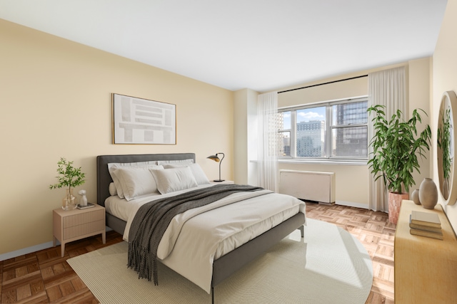 bedroom with radiator and parquet floors