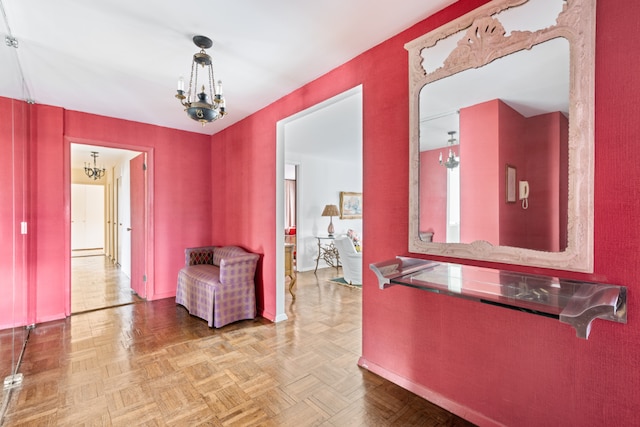 hallway with parquet floors, a chandelier, and a baseboard radiator