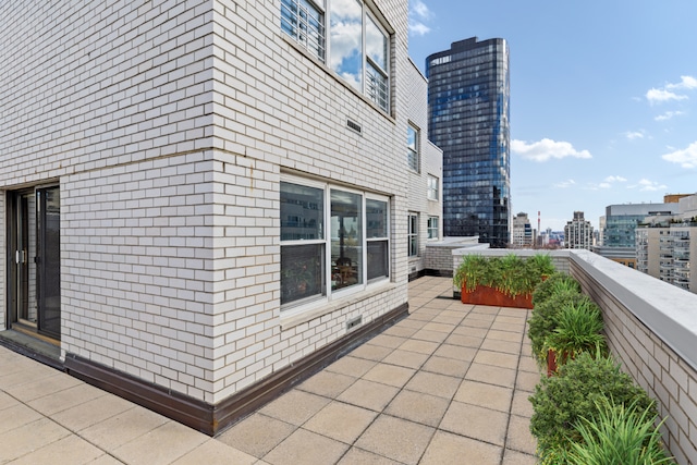 view of side of property featuring a patio