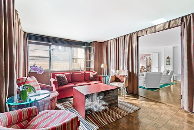 living room featuring parquet flooring