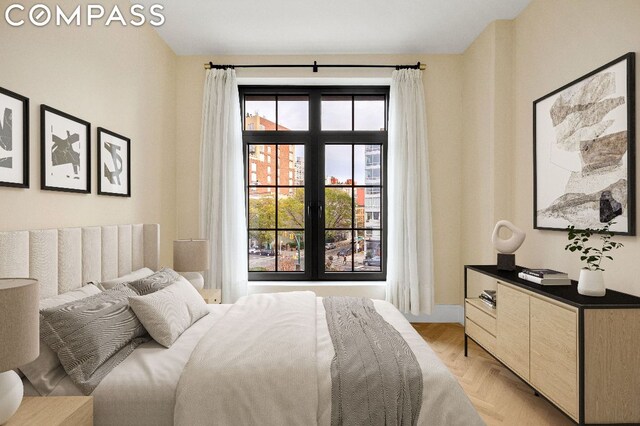 bedroom with light parquet floors