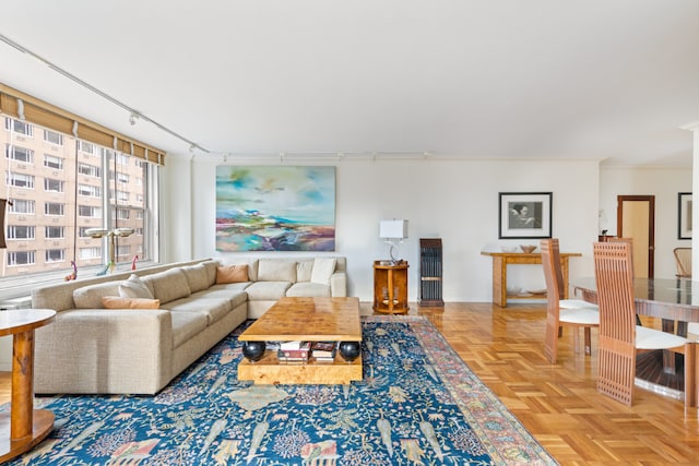 living room with parquet floors and rail lighting