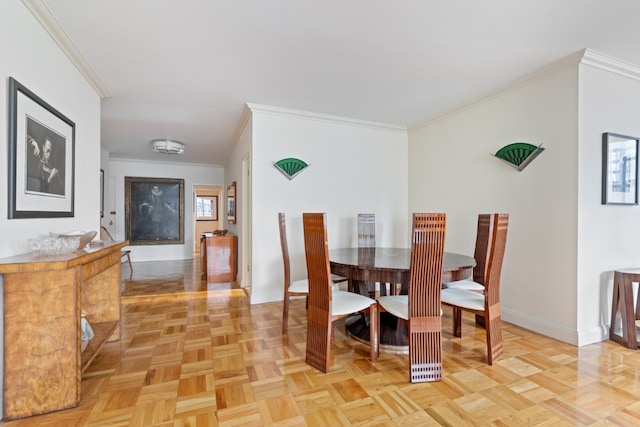 dining area featuring crown molding and light parquet floors