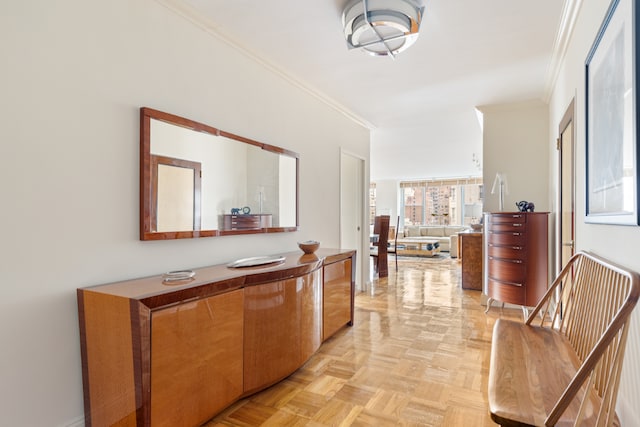 hallway with light parquet floors and ornamental molding