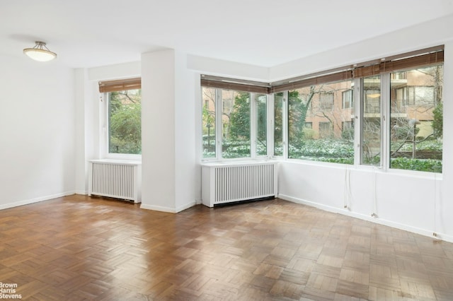 unfurnished sunroom with radiator