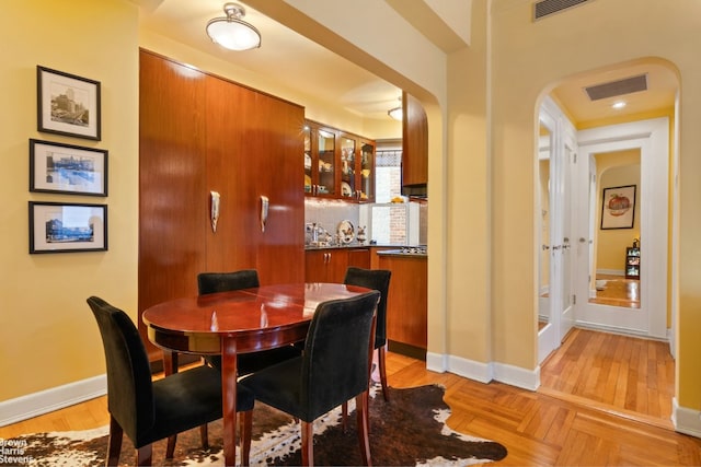 dining room featuring light parquet flooring