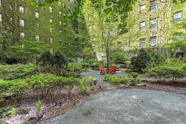 view of property's community with a patio area