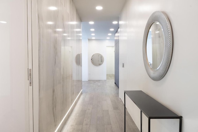 corridor with light wood-type flooring