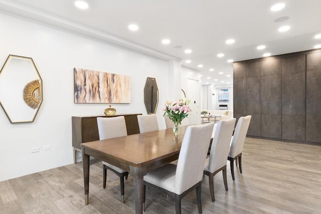 dining space with light wood-type flooring