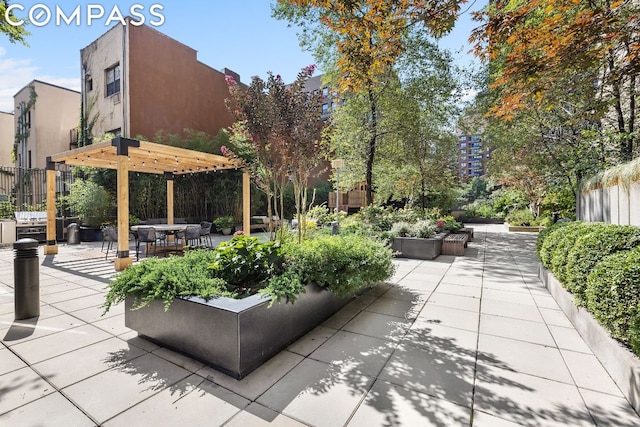 view of home's community featuring a patio area and a pergola