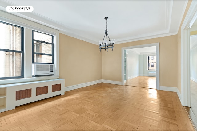 unfurnished dining area featuring crown molding, visible vents, radiator heating unit, a chandelier, and baseboards