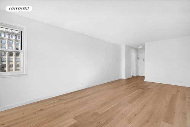 spare room with light hardwood / wood-style flooring