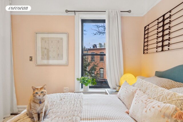 bedroom featuring crown molding