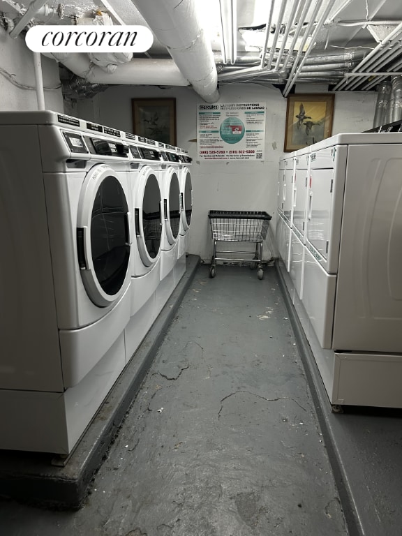 washroom featuring washing machine and clothes dryer