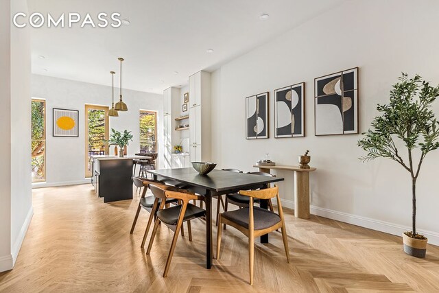 dining space featuring baseboards