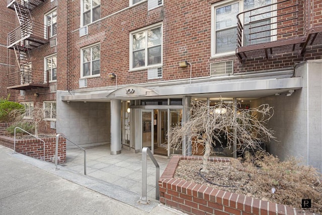 entrance to property featuring a patio