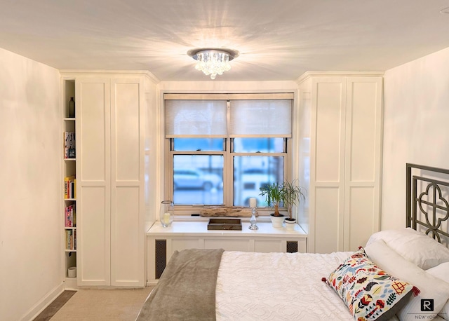 bedroom featuring a chandelier and visible vents