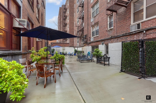 view of patio / terrace featuring a wall mounted air conditioner