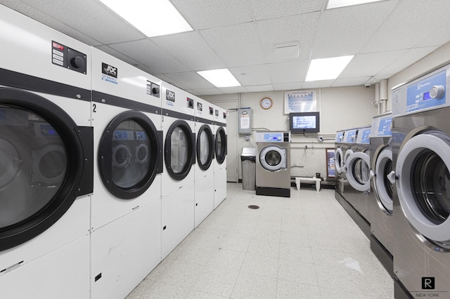 common laundry area featuring light floors, separate washer and dryer, and stacked washer / drying machine