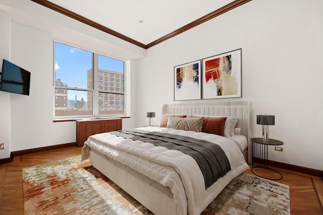 bedroom with crown molding, baseboards, a city view, and wood finished floors