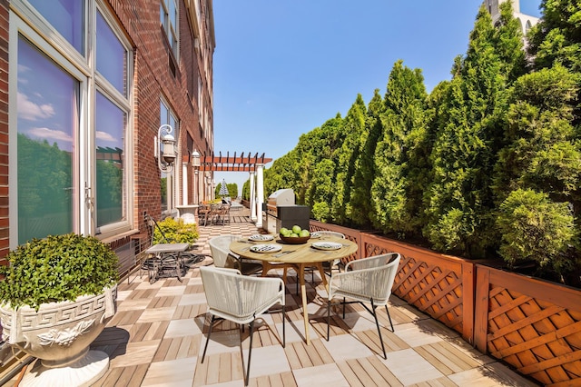 view of patio / terrace featuring area for grilling, a pergola, and outdoor dining space