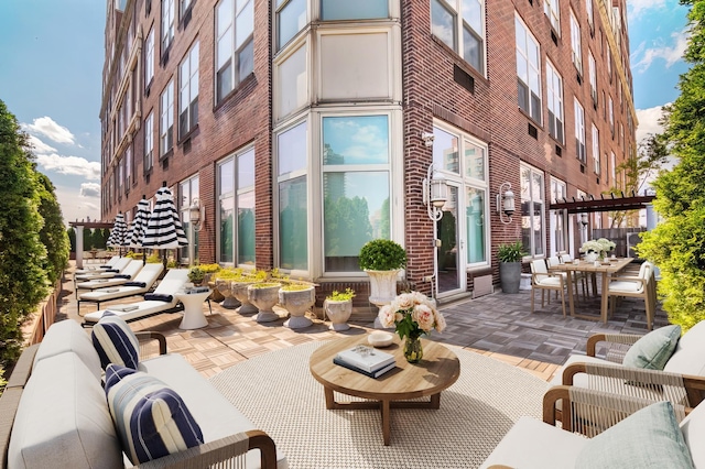 view of patio featuring outdoor dining space and outdoor lounge area