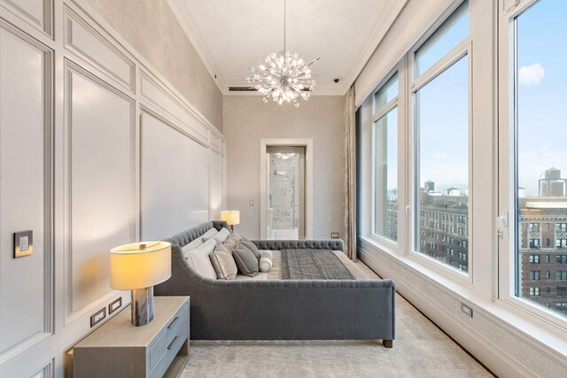 bedroom with crown molding and a chandelier