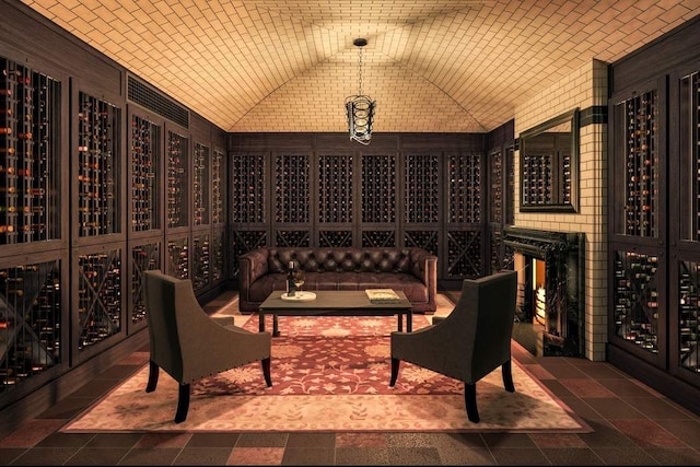 wine area with vaulted ceiling and brick ceiling