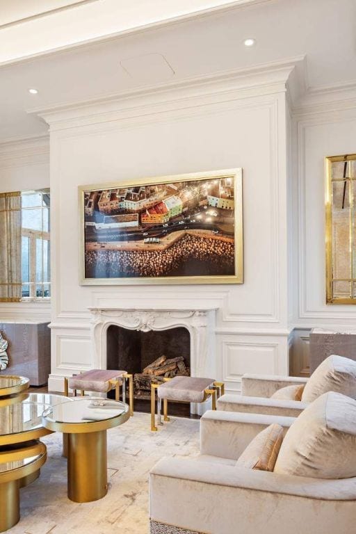 sitting room with crown molding and a fireplace