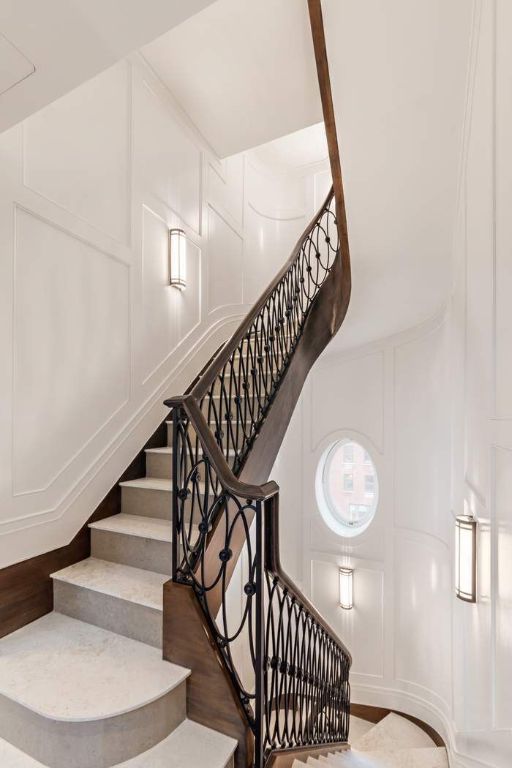 staircase with hardwood / wood-style flooring