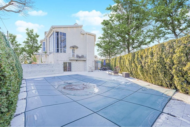 view of swimming pool featuring a patio