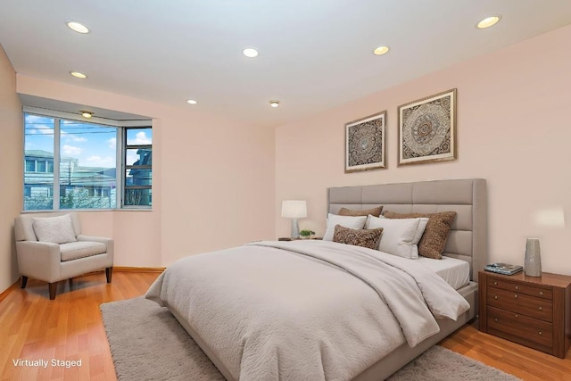 bedroom with light hardwood / wood-style flooring