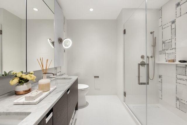 bathroom featuring toilet, tile walls, an enclosed shower, and vanity