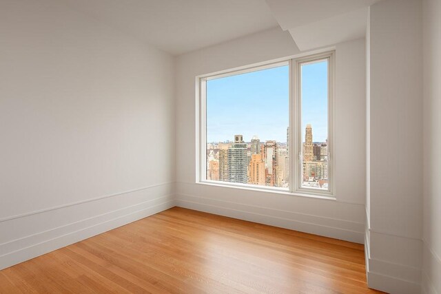 spare room featuring light hardwood / wood-style floors