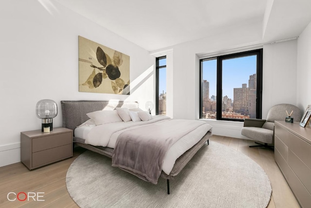 bedroom featuring light wood-type flooring