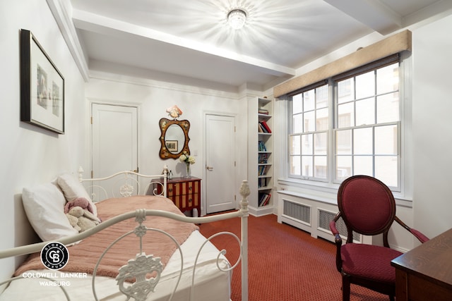 carpeted bedroom with beam ceiling