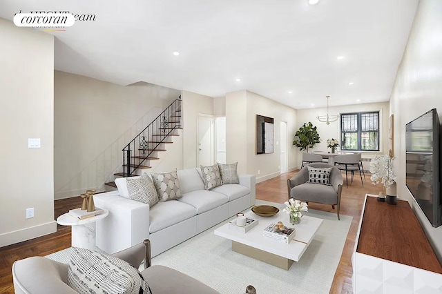 living area featuring visible vents, baseboards, stairway, recessed lighting, and wood finished floors