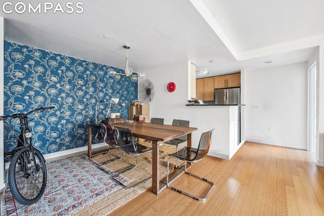 dining area with light hardwood / wood-style floors