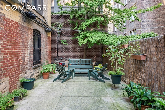 view of patio / terrace featuring fence