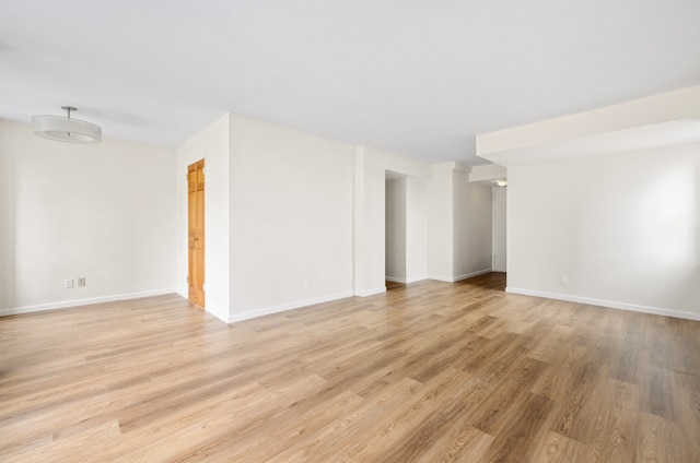 unfurnished room with light hardwood / wood-style floors