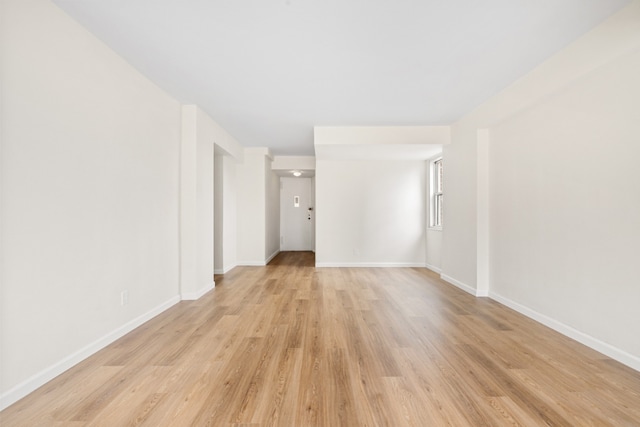 unfurnished room with light hardwood / wood-style flooring