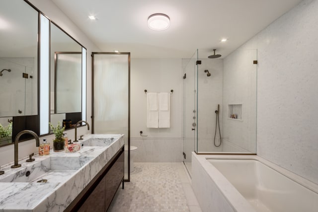 full bathroom featuring toilet, vanity, and separate shower and tub