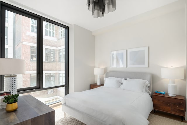 bedroom with floor to ceiling windows